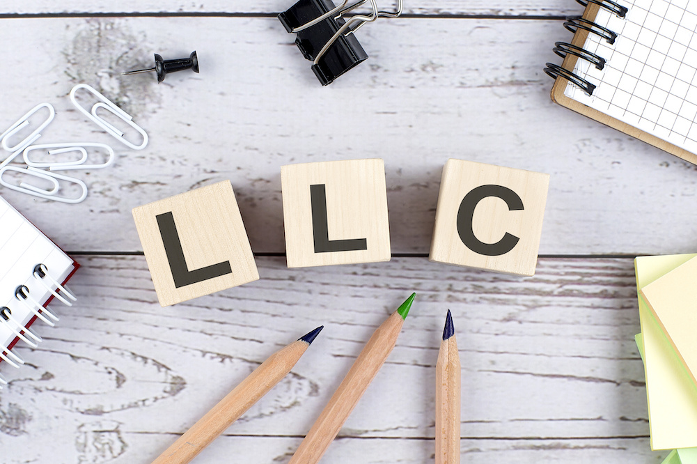 Illustration of a legal document with the title 'Understanding LLCs'